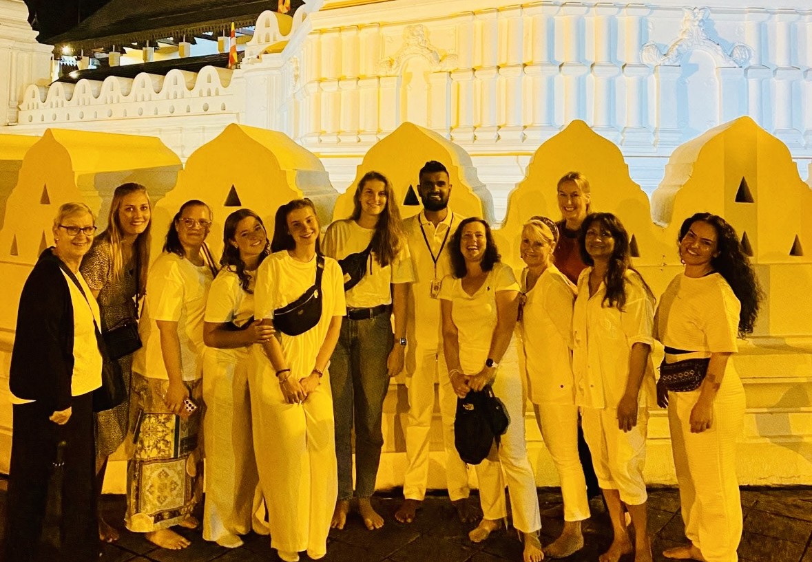 Group of travelers at the Temple of the Tooth in Kandy